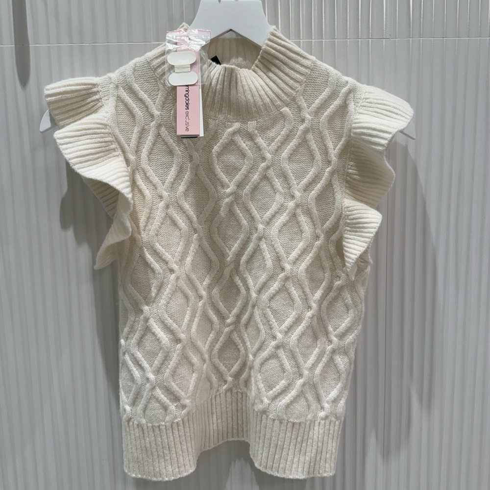 This is a cream cashmere AQUA top.
